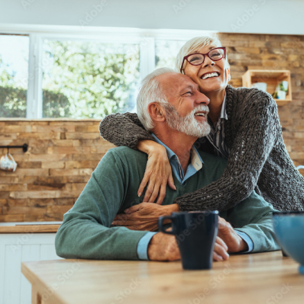 Elderly couple cuddling