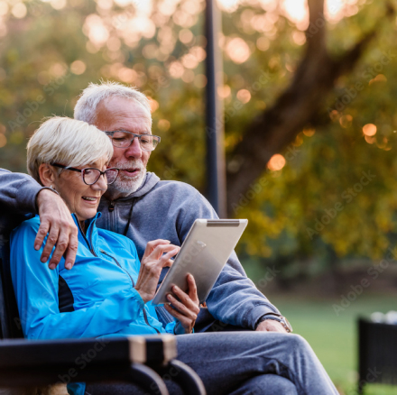 Elderly couple looking at tablet