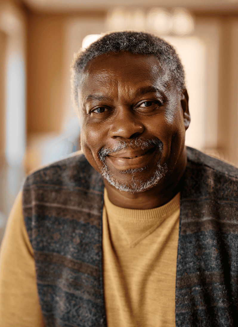 A man smiling in the camera